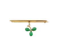 A bar brooch with a diamond and stone set clover drop