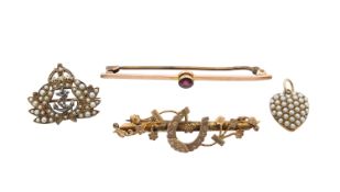 A group of three brooches and a locket