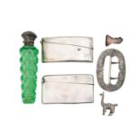 A silver scent bottle, two card cases, a shoe buckle and a llama