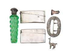 A silver scent bottle, two card cases, a shoe buckle and a llama