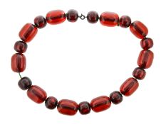 A set of cherry amber beads