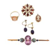 A 9ct garnet flower brooch, amethyst ear pendants and three more