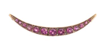 A gem set crescent moon brooch