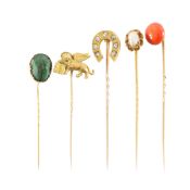 A diamond horse shoe stick pin, scarab beetle, pearl and two more