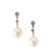 A pair of diamond and pearl drop ear pendants