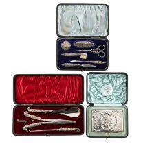 A Victorian silver manicure set, a boot or glove set and a card case
