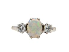 An 18ct opal and diamond three stone ring