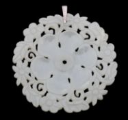 A Chinese large pierced and carved pale jade pendant