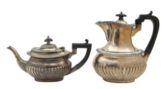 A Mappin & Webb silver teapot and hot water jug