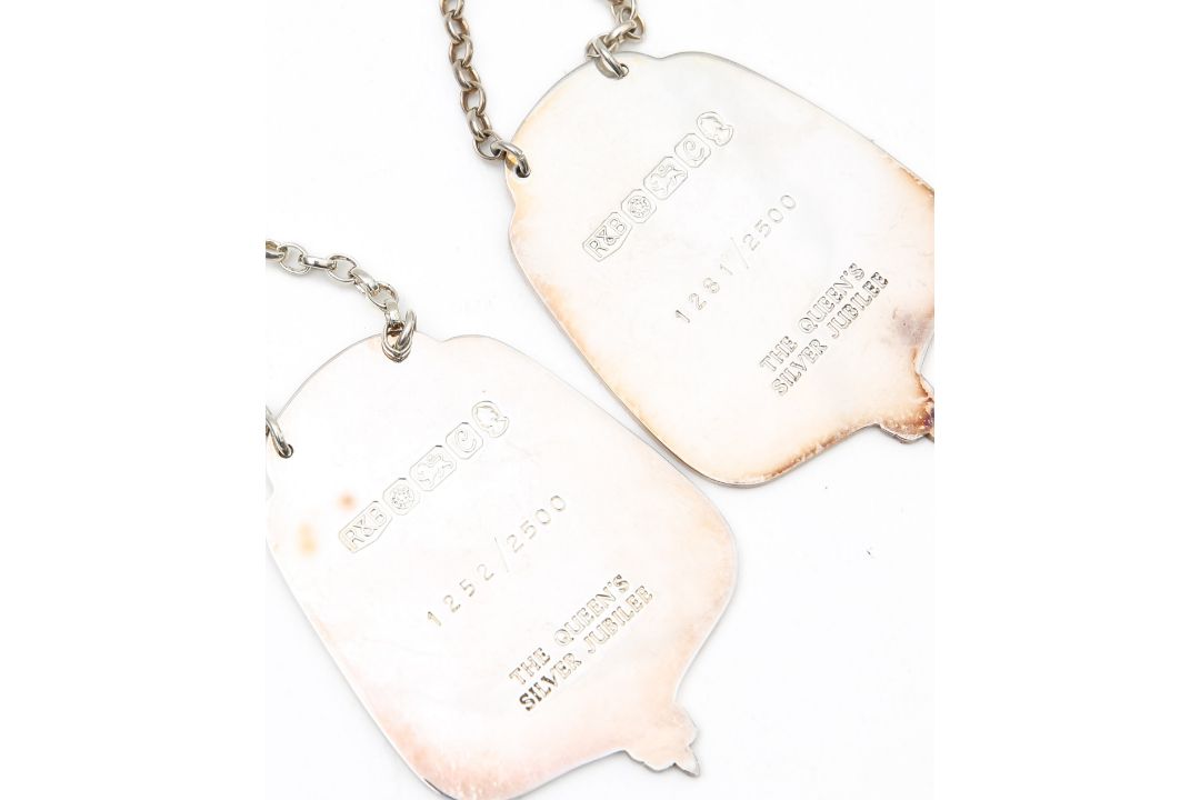 A group of five silver decanter labels, a Millennium coaster and a Peruvian silver mounted cork - Image 2 of 2