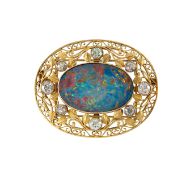 A black opal and diamond-set brooch