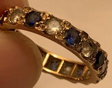 UNHALLMARKED YELLOW METAL ETERNITY RING SET WITH EIGHT SAPPHIRES APPROX 0.15ct AND EIGHT SPINELS