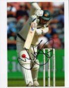 Justin Langer signed 10x8 inch colour photo pictured in action for Australia. Good condition Est.