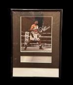 Amir Khan signed colour photo. Mounted and framed to approx size 12x8inch. Good condition Est.