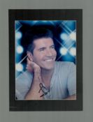 Simon Cowell signed 12x8 inch overall mounted colour photo. Good condition Est.