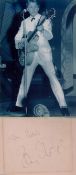 Tommy Steele signed album page, black and white photo and magazine bio sheet. Good condition Est.