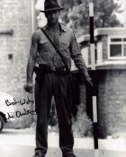 Vic Armstrong signed black and white movie still, from his role as Harrison Ford's stunt double in