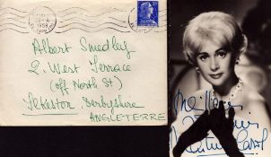 Martine Carol signed 6x4 inch black and white postcard photo with original 1959 mailing envelope.