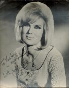 Dusty Springfield signed 16x12inch black and white photo. Some knocks to edges. Dedicated. Good