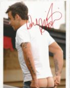 Robbie Williams signed 10x8 inch colour photo. Good condition Est.