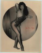 Bettie Page signed 10x8 inch black and white photo. Good condition Est.