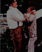 Roger Moore and Richard Kiel signed 10x8 inch colour photo. Good condition. All autographs come with