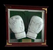 Multi signed World Championship Boxing Gloves signed by champions in display case signed by,