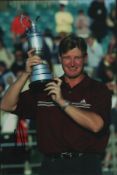 Ernie Els signed 12x8inch colour photo pictured with the Open Championship Claret Jug. Good