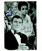 George Lazenby and Shakira Caine signed Jame Bond On Her Majesty's Secret Service 10x8inch black and