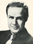 Marlon Brando signed 8x6 inch black and white newspaper photo. Good condition. All autographs come