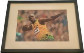 Athletics, Usain Bolt signed 17x13inch framed and mounted London 2012 Olympics colour photo.