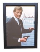 Roger Moore signed 13x10inch overall framed James Bond colour photo. Good condition. All