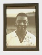 Football, Pele signed 13x10inch overall framed vintage Santos F.C black and white photo. Good