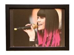 Jessie J signed 13x10inch overall framed colour photo. Good condition. All autographs come with a