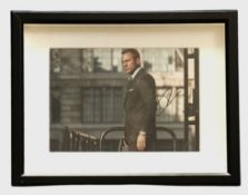 Daniel Craig signed 17x13inch overall framed and mounted James Bond colour photo. Good condition.