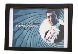 George Lazenby signed 13x10inch overall mounted and framed James Bond colour photo. Good