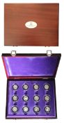 Coins. Queen Elizabeth commemorative 12 fifty Pence coins in case Display wooden presentation box