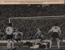 Nobby Stiles MBE, George Cohen MBE and Gordon Banks OBE multi signed black and white magazine photo.