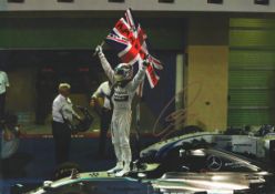 Formula One Lewis Hamilton signed 16x12inch colour photo pictured celebrating during his time with