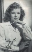Shirley Temple signed 5x3inch black and white photo with original Del in the Sun Stamp and PM on