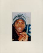 Nigel Benn signed colour photo. Is a British former professional boxer. Mounted 10 x 8 inch. Good
