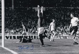 Autographed STUART PEARSON 12 x 8 photo : B/W, depicting Man United's STUART PEARSON punching the