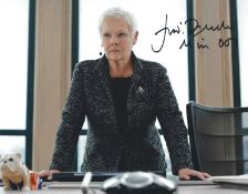 Judi Dench signed 10x8inch James Bond colour photo. Good condition. All autographs come with a