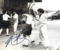 Yuen Qui signed 10x8inch James Bond black and white photo. Good condition. All autographs come