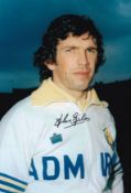 Autographed JOHN GILES 12 x 8 photo : Col, depicting Leeds United midfielder JOHN GILES posing for