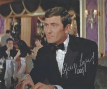 George Lazenby signed James Bond colour photo. Good condition. All autographs come with a