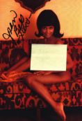 Jean Bell signed 7x5inch risque colour photo. Good condition. All autographs come with a Certificate