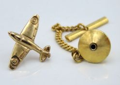 A 9ct gold Spitfire plane tin pin with fixing stud