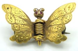 An antique 18ct gold moth brooch set with possibly