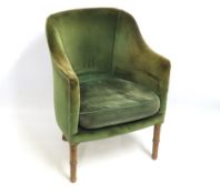 An antique upholstered bucket chair, 820mm high to